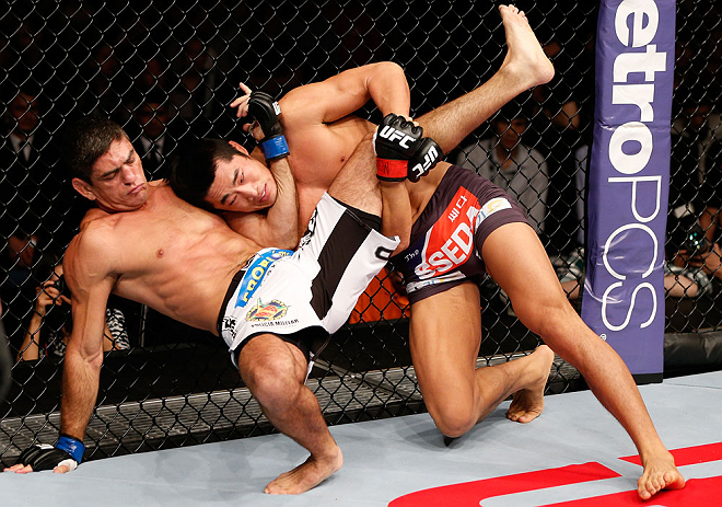 MACAU, MACAU - NOVEMBER 10: (R-L) Dong Hyun Kim attempts to take down Paulo Thiago during their welterweight bout at the UFC Macao event inside CotaiArena on November 10, 2012 in Macau, Macau. (Photo by Josh Hedges/Zuffa LLC/Zuffa LLC via Getty Images)