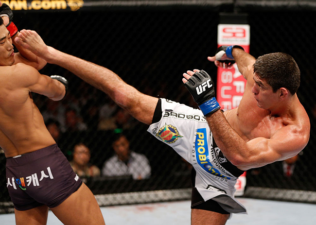 MACAU, MACAU - NOVEMBER 10: (R-L) Paulo Thiago kicks Dong Hyun Kim during their welterweight bout at the UFC Macao event inside CotaiArena on November 10, 2012 in Macau, Macau. (Photo by Josh Hedges/Zuffa LLC/Zuffa LLC via Getty Images)
