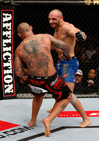 MACAU, MACAU - NOVEMBER 10: (R-L) Stanislav Nedkov knocks down Thiago Silva with a punch during their light heavyweight bout at the UFC Macao event inside CotaiArena on November 10, 2012 in Macau, Macau. (Photo by Josh Hedges/Zuffa LLC/Zuffa LLC via Getty Images)