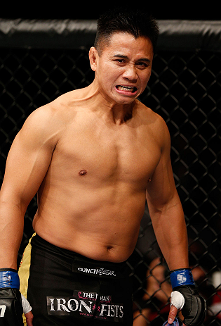 MACAU, MACAU - NOVEMBER 10: Cung Le stands in the Octagon before his middleweight bout against Rich Franklin at the UFC Macao event inside CotaiArena on November 10, 2012 in Macau, Macau. (Photo by Josh Hedges/Zuffa LLC/Zuffa LLC via Getty Images)