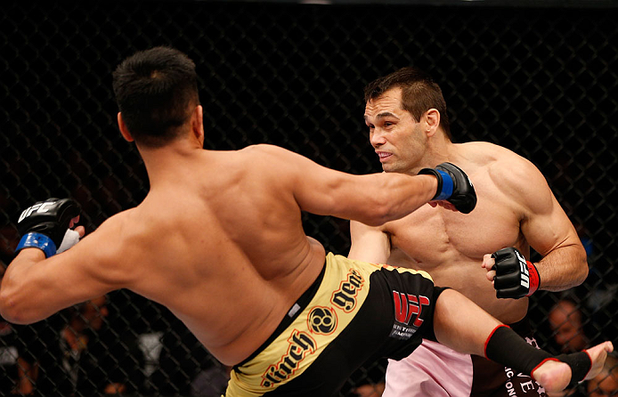 MACAU, MACAU - NOVEMBER 10: (L-R) Cung Le kicks Rich Franklin during their middleweight bout at the UFC Macao event inside CotaiArena on November 10, 2012 in Macau, Macau. (Photo by Josh Hedges/Zuffa LLC/Zuffa LLC via Getty Images)
