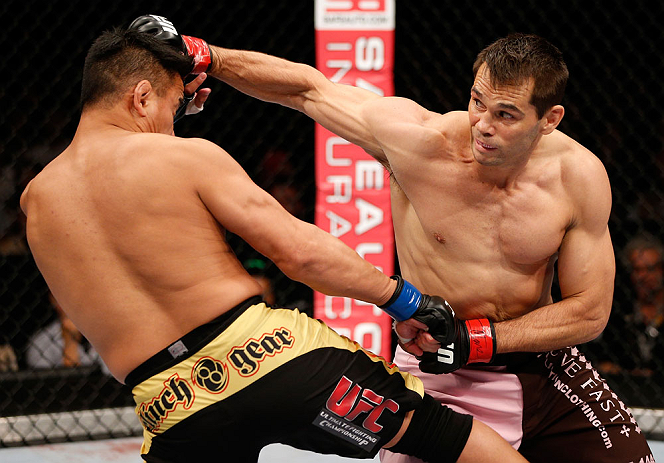 MACAU, MACAU - NOVEMBER 10: (R-L) Rich Franklin punches Cung Le during their middleweight bout at the UFC Macao event inside CotaiArena on November 10, 2012 in Macau, Macau. (Photo by Josh Hedges/Zuffa LLC/Zuffa LLC via Getty Images)