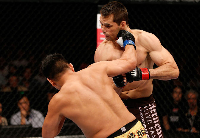 MACAU, MACAU - NOVEMBER 10: (L-R) Cung Le knocks out Rich Franklin with a punch during their middleweight bout at the UFC Macao event inside CotaiArena on November 10, 2012 in Macau, Macau. (Photo by Josh Hedges/Zuffa LLC/Zuffa LLC via Getty Images)