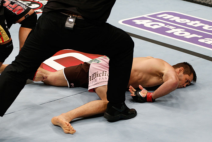 MACAU, MACAU - NOVEMBER 10: Rich Franklin lays on the canvas after being knocked out by Cung Le during their middleweight bout at the UFC Macao event inside CotaiArena on November 10, 2012 in Macau, Macau. (Photo by Josh Hedges/Zuffa LLC/Zuffa LLC via Getty Images)