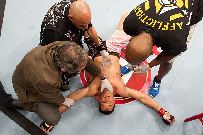 MACAU, MACAU - NOVEMBER 10:  Rich Franklin lays on the canvas after being knocked out by Cung Le during their middleweight bout at the UFC Macao event inside CotaiArena on November 10, 2012 in Macau, Macau.  (Photo by Josh Hedges/Zuffa LLC/Zuffa LLC via Getty Images)