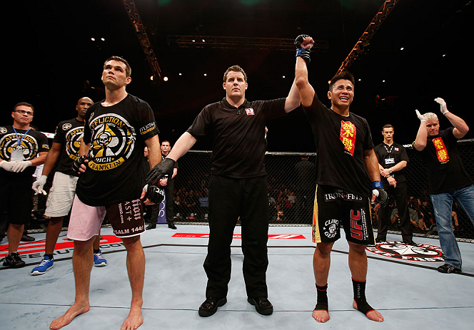 MACAU, MACAU - NOVEMBER 10: Cung Le (R) reacts after knocking out Rich Franklin during their middleweight bout at the UFC Macao event inside CotaiArena on November 10, 2012 in Macau, Macau. (Photo by Josh Hedges/Zuffa LLC/Zuffa LLC via Getty Images)