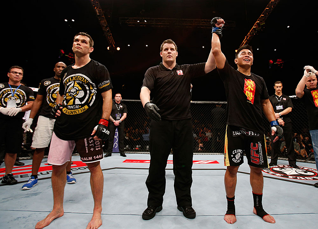 MACAU, MACAU - NOVEMBER 10: Cung Le (R) reacts after knocking out Rich Franklin during their middleweight bout at the UFC Macao event inside CotaiArena on November 10, 2012 in Macau, Macau. (Photo by Josh Hedges/Zuffa LLC/Zuffa LLC via Getty Images)
