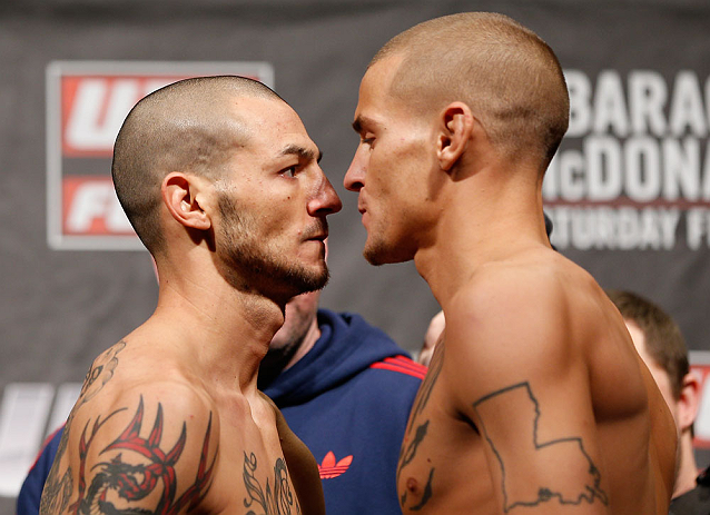 LONDON, ENGLAND - FEBRUARY 15:  (L-R) Opponents Cub Swanson and Dustin Poirier face off during the UFC weigh-in on February 15, 2013 at Wembley Arena in London, England.  (Photo by Josh Hedges/Zuffa LLC/Zuffa LLC via Getty Images)