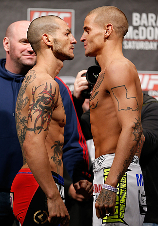 LONDON, ENGLAND - FEBRUARY 15:  (L-R) Opponents Cub Swanson and Dustin Poirier face off during the UFC weigh-in on February 15, 2013 at Wembley Arena in London, England.  (Photo by Josh Hedges/Zuffa LLC/Zuffa LLC via Getty Images)