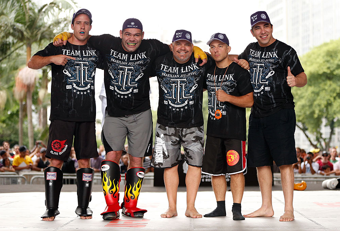 SAO PAULO, BRAZIL - JANUARY 16:  Gabriel Gonzaga (second from left) poses for photos with his team after an open workout session for media and fans on January 16, 2013 at Parque Anhangaba&Atilde;&ordm; in Sao Paulo, Brazil. (Photo by Josh Hedges/Zuffa LLC/Zuffa LLC via Getty Images)
