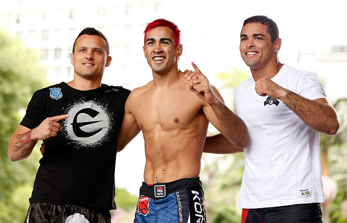 SAO PAULO, BRAZIL - JANUARY 16:  Godofredo "Pepey" Castro (center) poses for photos with his team after an open workout session for media and fans on January 16, 2013 at Parque Anhangabau in Sao Paulo, Brazil. (Photo by Josh Hedges/Zuffa LLC/Zuffa LLC via Getty Images)