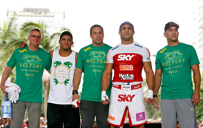 SAO PAULO, BRAZIL - JANUARY 16:  Vitor Belfort (second from right) poses for photos with his team after an open workout session for media and fans on January 16, 2013 at Parque Anhangabau in Sao Paulo, Brazil. (Photo by Josh Hedges/Zuffa LLC/Zuffa LLC via Getty Images)