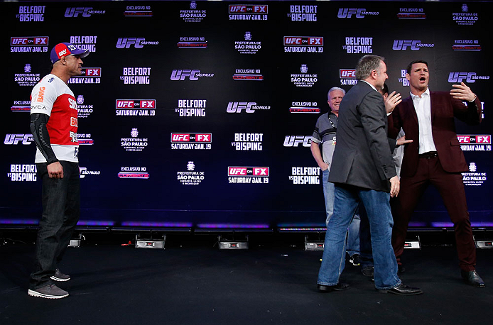 SAO PAULO, BRAZIL - JANUARY 17:  Opponents Vitor Belfort (L) and Michael Bisping (R) are separated after a heated face off during a UFC press conference on January 17, 2013 at the Hilton Hotel in Sao Paulo, Brazil. (Photo by Josh Hedges/Zuffa LLC/Zuffa LLC via Getty Images)