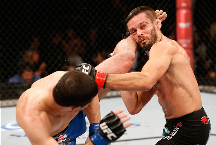 Magomedov (left) kicks <a href='../fighter/Rodrigo-Damm'>Rodrigo Damm</a>