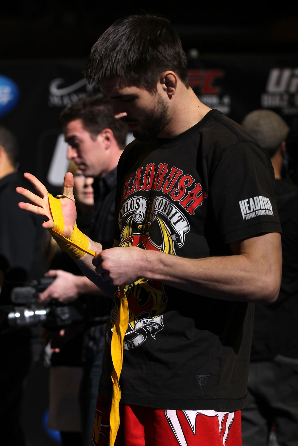 LAS VEGAS, NV - FEBRUARY 01: Carlos Condit wraps his hands before working out for the media and fans during the UFC 143 open workouts at Mandalay Bay Events Center on February 1, 2012 in Las Vegas, United States. (Photo by Josh Hedges/Zuffa LLC/Zuffa LLC via Getty Images) *** Local Caption *** Carlos Condit