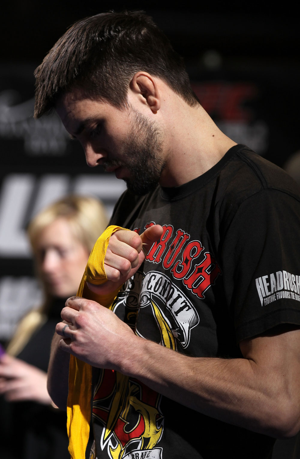 LAS VEGAS, NV - FEBRUARY 01: Carlos Condit wraps his hands before working out for the media and fans during the UFC 143 open workouts at Mandalay Bay Events Center on February 1, 2012 in Las Vegas, United States. (Photo by Josh Hedges/Zuffa LLC/Zuffa LLC via Getty Images) *** Local Caption *** Carlos Condit