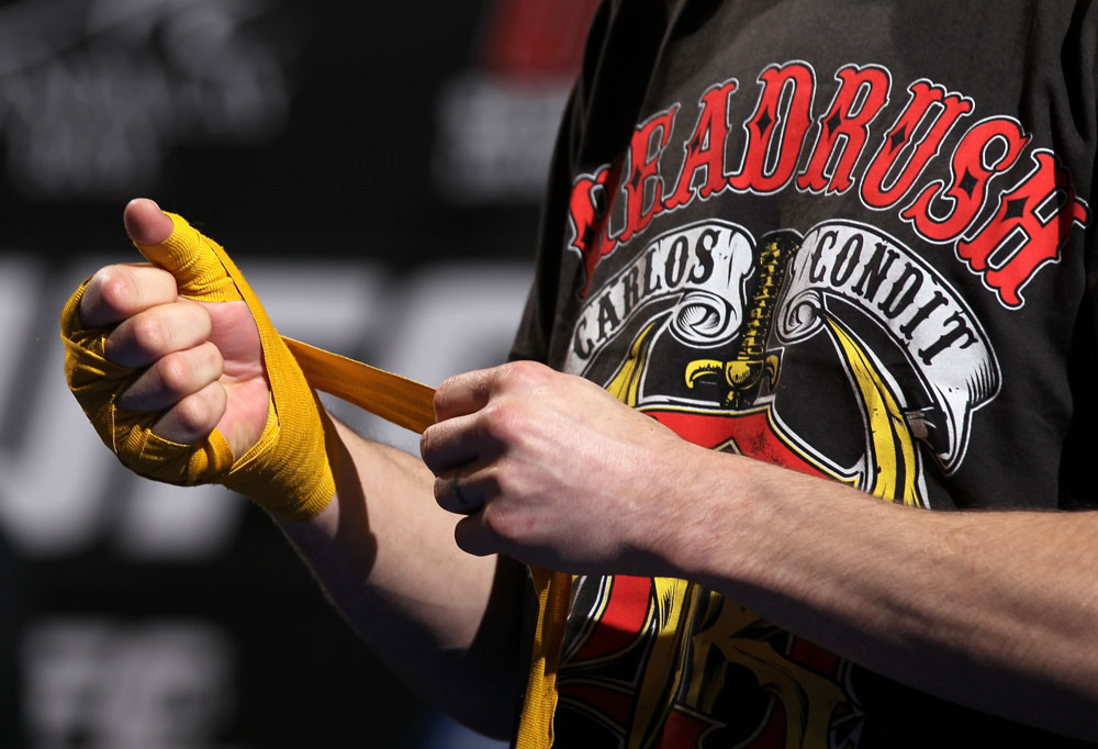 LAS VEGAS, NV - FEBRUARY 01: Carlos Condit wraps his hands before working out for the media and fans during the UFC 143 open workouts at Mandalay Bay Events Center on February 1, 2012 in Las Vegas, United States. (Photo by Josh Hedges/Zuffa LLC/Zuffa LLC via Getty Images) *** Local Caption *** Carlos Condit