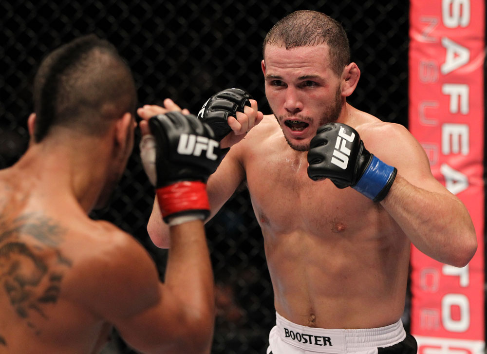 STOCKHOLM, SWEDEN - APRIL 14: (R-L) Eric Wisely faces off with Jason Young during their featherweight bout at the UFC on Fuel TV event at Ericsson Globe on April 14, 2012 in Stockholm, Sweden. (Photo by Josh Hedges/Zuffa LLC/Zuffa LLC via Getty Images)