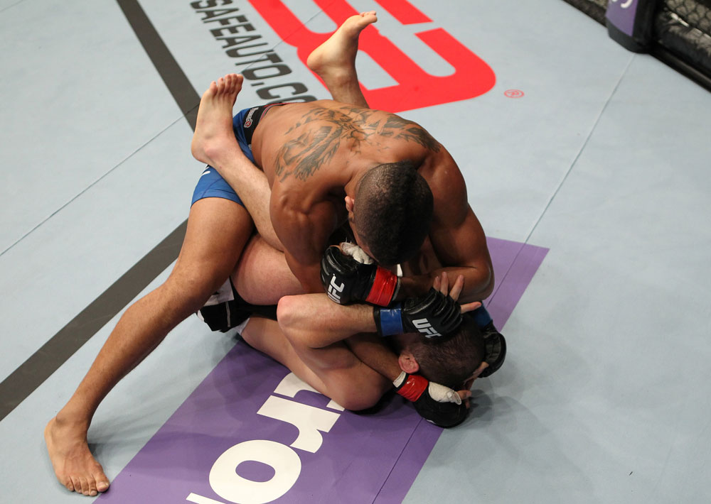 STOCKHOLM, SWEDEN - APRIL 14: (L-R) Jason Young punches Eric Wisely during their featherweight bout at the UFC on Fuel TV event at Ericsson Globe on April 14, 2012 in Stockholm, Sweden. (Photo by Josh Hedges/Zuffa LLC/Zuffa LLC via Getty Images)