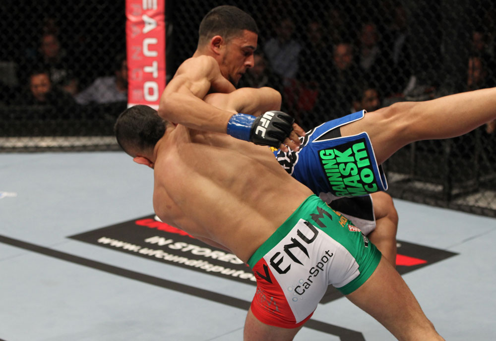 STOCKHOLM, SWEDEN - APRIL 14: (L-R) Reza Madadi slams Yoislandy Izquierdo to the mat during their lightweight bout at the UFC on Fuel TV event at Ericsson Globe on April 14, 2012 in Stockholm, Sweden. (Photo by Josh Hedges/Zuffa LLC/Zuffa LLC via Getty Images)