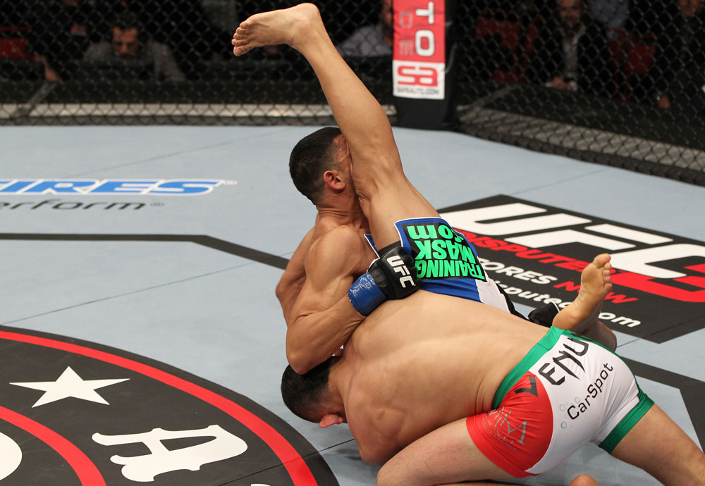 STOCKHOLM, SWEDEN - APRIL 14: (L-R) Reza Madadi slams Yoislandy Izquierdo to the mat during their lightweight bout at the UFC on Fuel TV event at Ericsson Globe on April 14, 2012 in Stockholm, Sweden. (Photo by Josh Hedges/Zuffa LLC/Zuffa LLC via Getty Images)