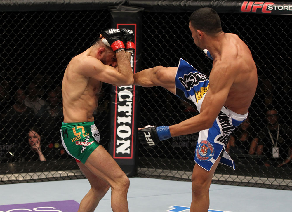 STOCKHOLM, SWEDEN - APRIL 14: (R-L) Yoislandy Izquierdo kicks Reza Madadi during their lightweight bout at the UFC on Fuel TV event at Ericsson Globe on April 14, 2012 in Stockholm, Sweden. (Photo by Josh Hedges/Zuffa LLC/Zuffa LLC via Getty Images)