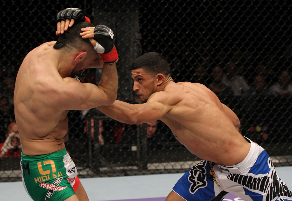 STOCKHOLM, SWEDEN - APRIL 14: (R-L) Yoislandy Izquierdo punches Reza Madadi during their lightweight bout at the UFC on Fuel TV event at Ericsson Globe on April 14, 2012 in Stockholm, Sweden. (Photo by Josh Hedges/Zuffa LLC/Zuffa LLC via Getty Images)