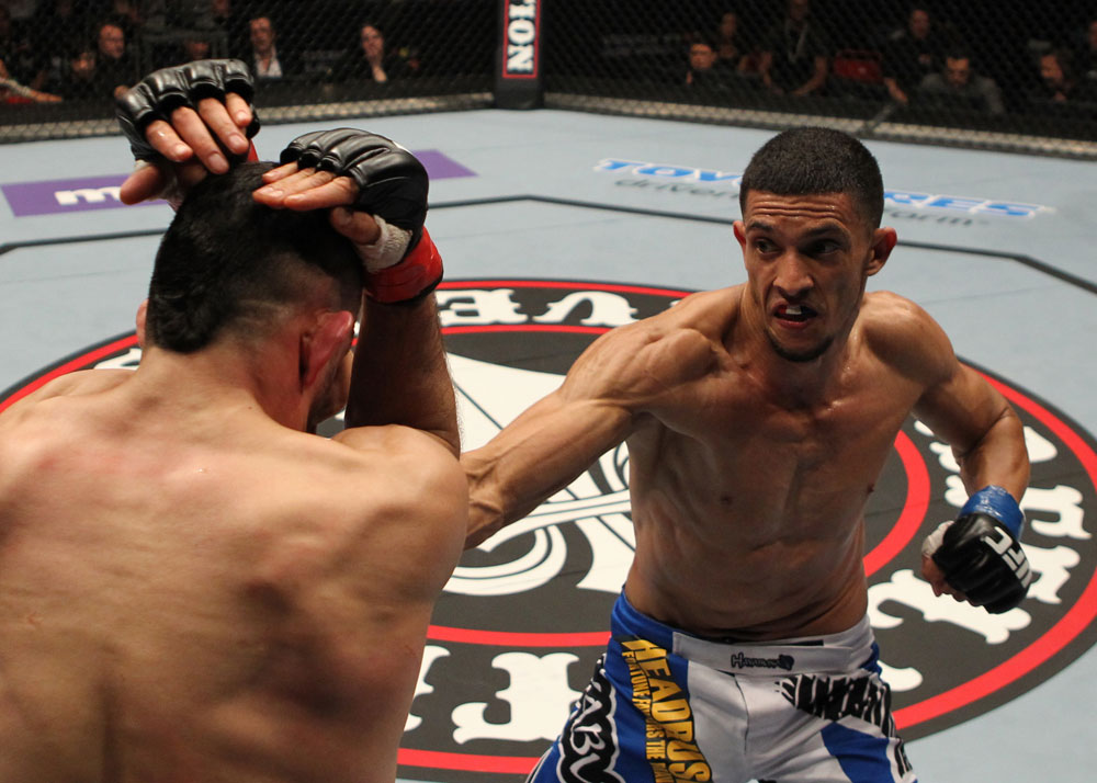 STOCKHOLM, SWEDEN - APRIL 14: (R-L) Yoislandy Izquierdo punches Reza Madadi during their lightweight bout at the UFC on Fuel TV event at Ericsson Globe on April 14, 2012 in Stockholm, Sweden. (Photo by Josh Hedges/Zuffa LLC/Zuffa LLC via Getty Images)