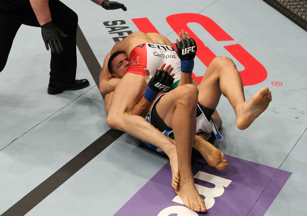 STOCKHOLM, SWEDEN - APRIL 14: (R-L) Reza Madadi secures a guillotine choke submission against Yoislandy Izquierdo during their lightweight bout at the UFC on Fuel TV event at Ericsson Globe on April 14, 2012 in Stockholm, Sweden. (Photo by Josh Hedges/Zuffa LLC/Zuffa LLC via Getty Images)