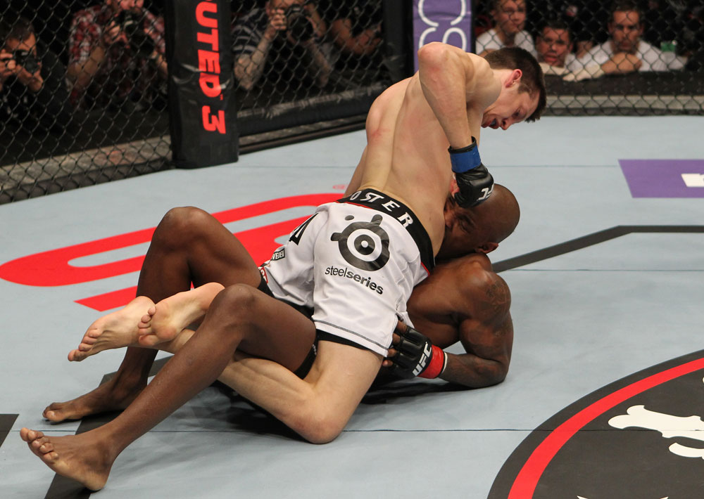 STOCKHOLM, SWEDEN - APRIL 14: Magnus Cedenblad (white shorts) punches down at Francis Carmont during their middleweight bout at the UFC on Fuel TV event at Ericsson Globe on April 14, 2012 in Stockholm, Sweden. (Photo by Josh Hedges/Zuffa LLC/Zuffa LLC via Getty Images)