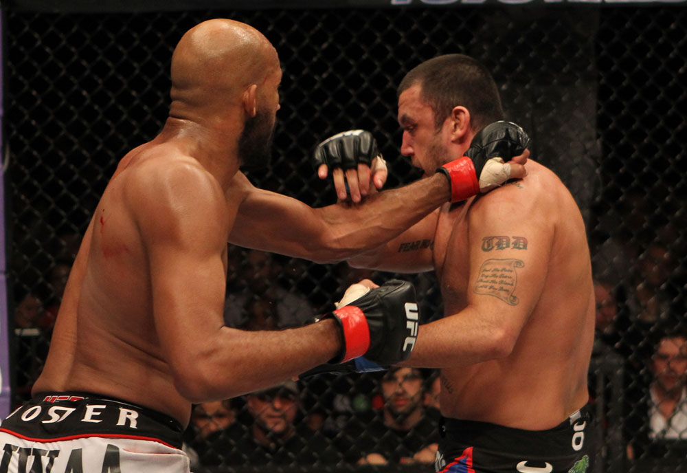 STOCKHOLM, SWEDEN - APRIL 14: (L-R) Cyrille Diabate punches Tom DeBlass during their light heavyweight bout at the UFC on Fuel TV event at Ericsson Globe on April 14, 2012 in Stockholm, Sweden. (Photo by Josh Hedges/Zuffa LLC/Zuffa LLC via Getty Images)