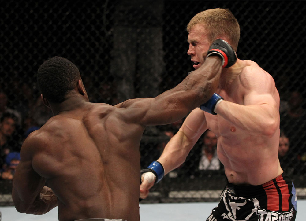 STOCKHOLM, SWEDEN - APRIL 14: (L-R) Papy Abedi punches James Head during their welterweight bout at the UFC on Fuel TV event at Ericsson Globe on April 14, 2012 in Stockholm, Sweden. (Photo by Josh Hedges/Zuffa LLC/Zuffa LLC via Getty Images)
