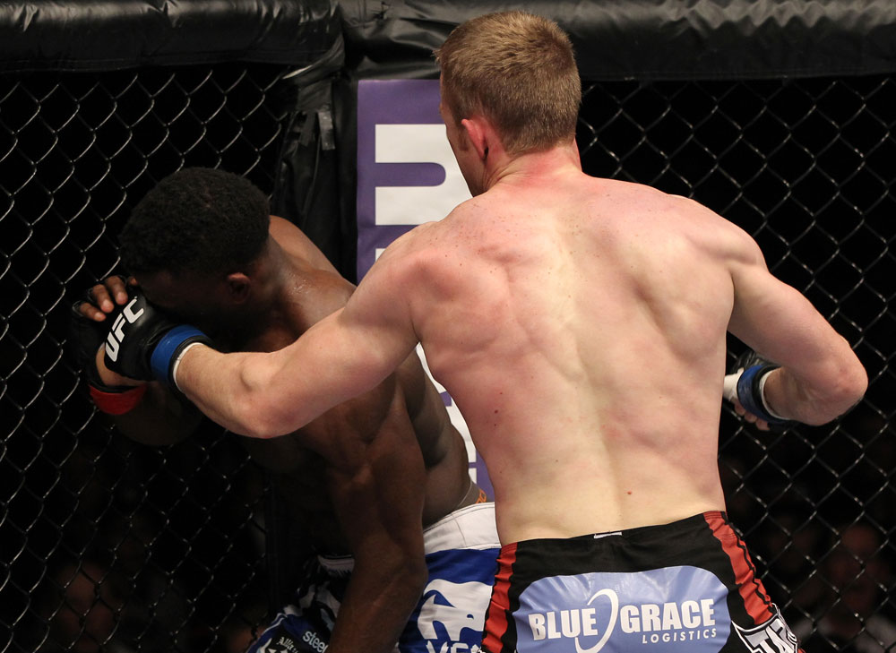 STOCKHOLM, SWEDEN - APRIL 14: (R-L) James Head punches Papy Abedi during their welterweight bout at the UFC on Fuel TV event at Ericsson Globe on April 14, 2012 in Stockholm, Sweden. (Photo by Josh Hedges/Zuffa LLC/Zuffa LLC via Getty Images)