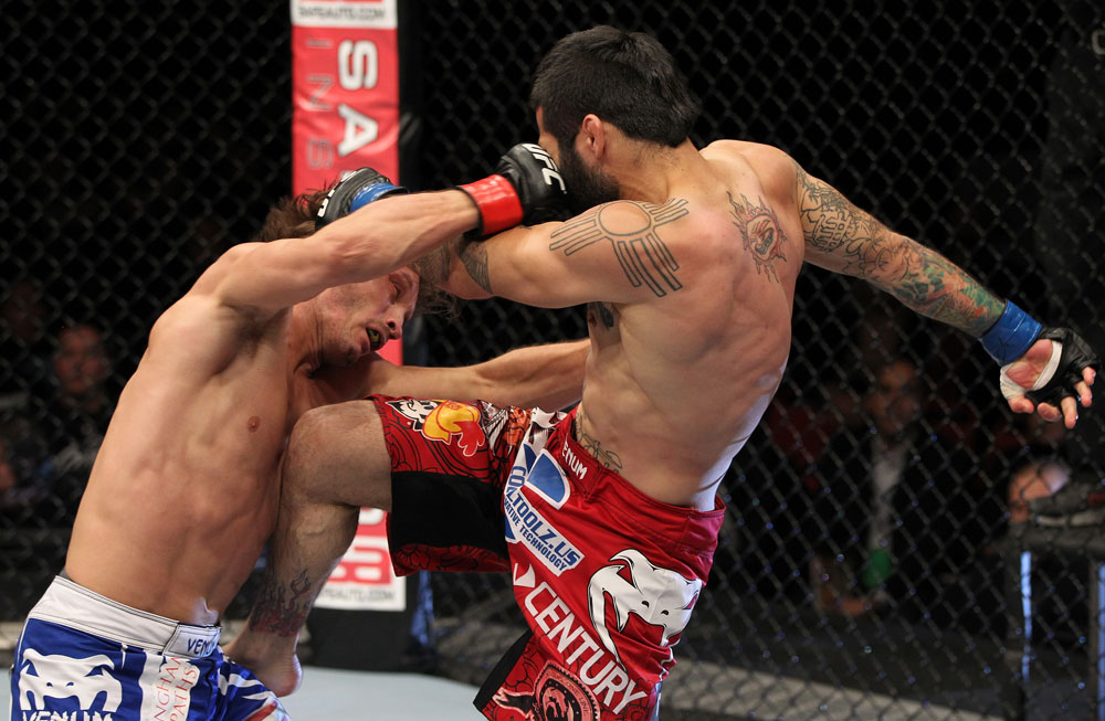 STOCKHOLM, SWEDEN - APRIL 14: (R-L) Damacio Page and Brad Pickett trade strikes during their bantamweight bout at the UFC on Fuel TV event at Ericsson Globe on April 14, 2012 in Stockholm, Sweden. (Photo by Josh Hedges/Zuffa LLC/Zuffa LLC via Getty Images)
