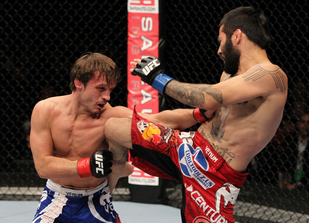 STOCKHOLM, SWEDEN - APRIL 14: (R-L) Damacio Page delivers a knee strike against Brad Pickett during their bantamweight bout at the UFC on Fuel TV event at Ericsson Globe on April 14, 2012 in Stockholm, Sweden. (Photo by Josh Hedges/Zuffa LLC/Zuffa LLC via Getty Images)