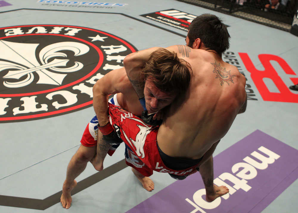 STOCKHOLM, SWEDEN - APRIL 14: (L-R) Brad Pickett takes down Damacio Page during their bantamweight bout at the UFC on Fuel TV event at Ericsson Globe on April 14, 2012 in Stockholm, Sweden. (Photo by Josh Hedges/Zuffa LLC/Zuffa LLC via Getty Images)