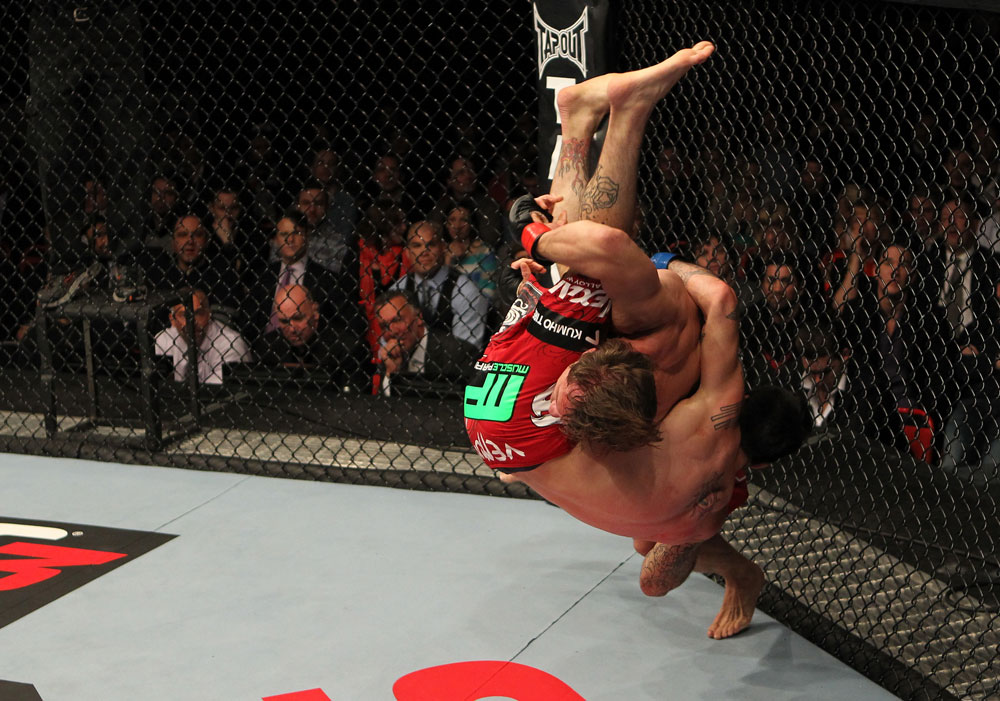 STOCKHOLM, SWEDEN - APRIL 14: (R-L) Brad Pickett takes down Damacio Page during their bantamweight bout at the UFC on Fuel TV event at Ericsson Globe on April 14, 2012 in Stockholm, Sweden. (Photo by Josh Hedges/Zuffa LLC/Zuffa LLC via Getty Images)