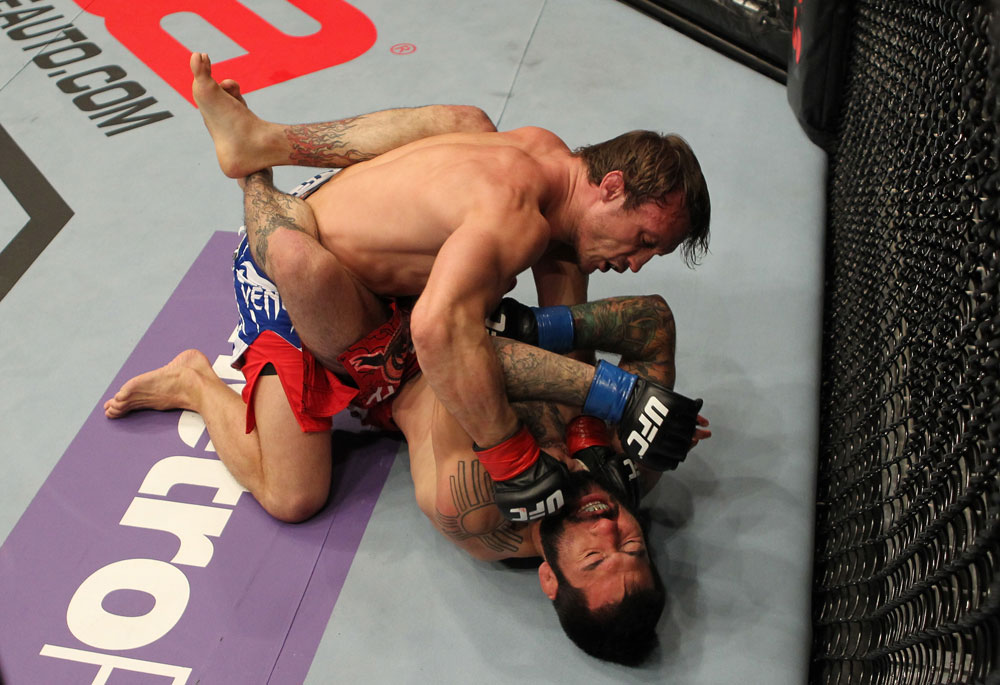 STOCKHOLM, SWEDEN - APRIL 14: (L-R) Brad Pickett punches Damacio Page during their bantamweight bout at the UFC on Fuel TV event at Ericsson Globe on April 14, 2012 in Stockholm, Sweden. (Photo by Josh Hedges/Zuffa LLC/Zuffa LLC via Getty Images)