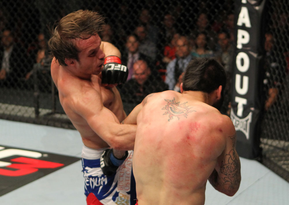 STOCKHOLM, SWEDEN - APRIL 14: (L-R) Brad Pickett punches Damacio Page during their bantamweight bout at the UFC on Fuel TV event at Ericsson Globe on April 14, 2012 in Stockholm, Sweden. (Photo by Josh Hedges/Zuffa LLC/Zuffa LLC via Getty Images)