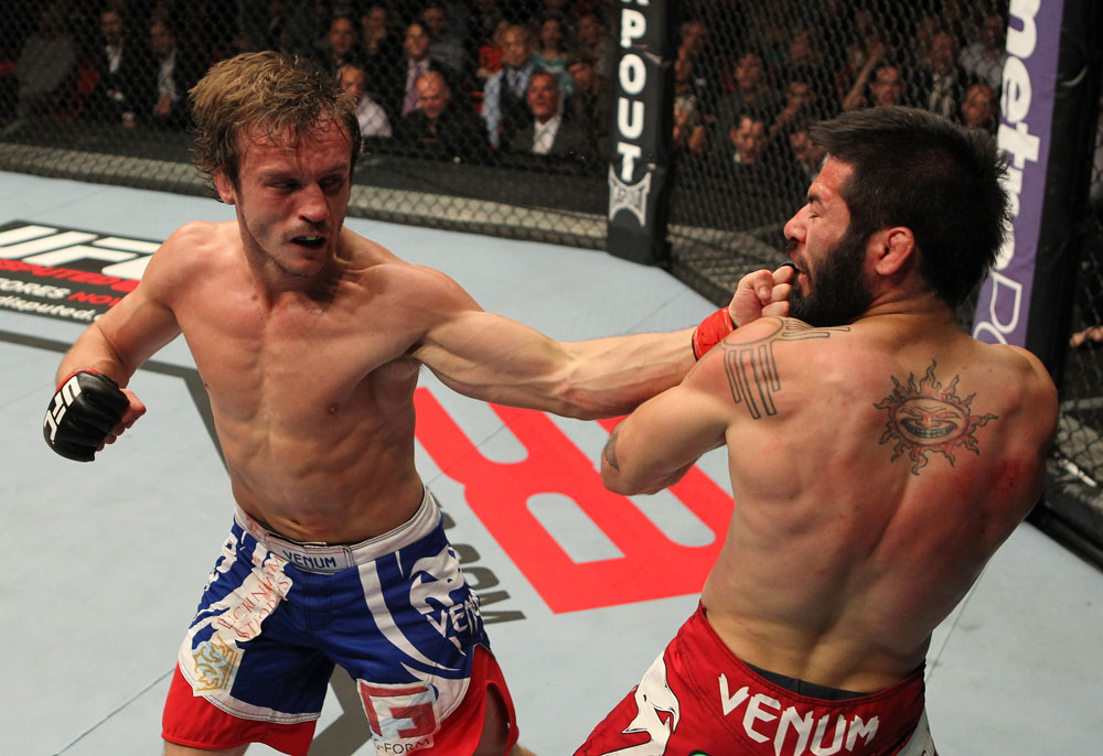 STOCKHOLM, SWEDEN - APRIL 14: (L-R) Brad Pickett punches Damacio Page during their bantamweight bout at the UFC on Fuel TV event at Ericsson Globe on April 14, 2012 in Stockholm, Sweden. (Photo by Josh Hedges/Zuffa LLC/Zuffa LLC via Getty Images)