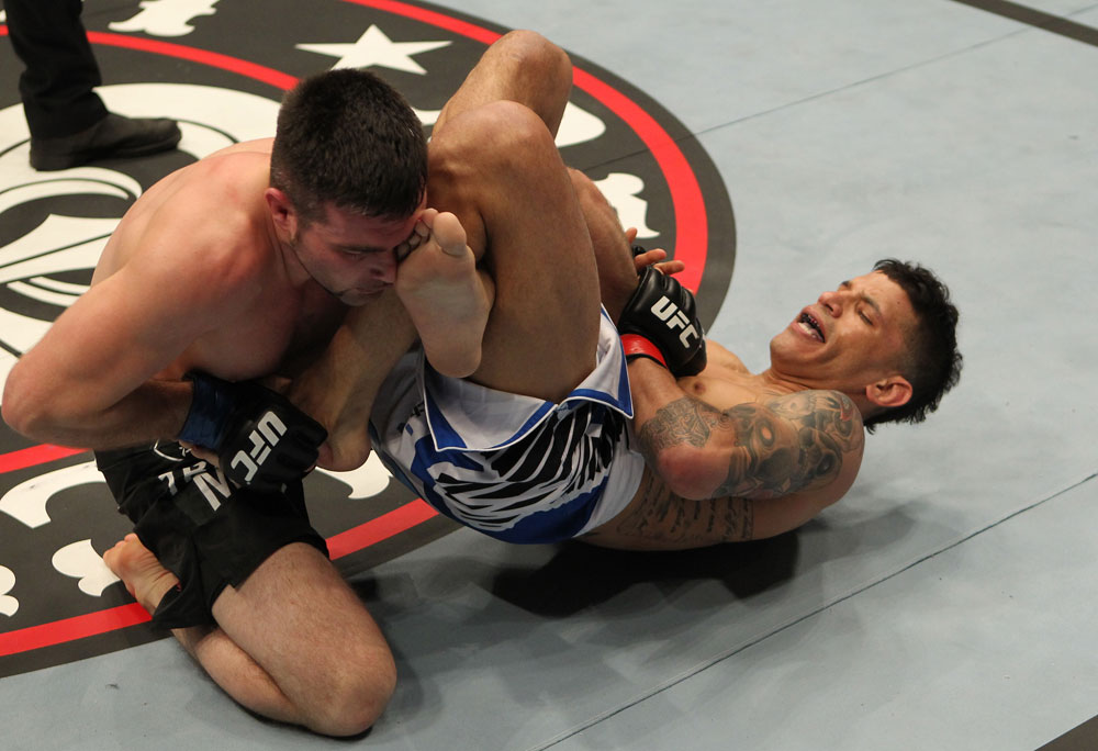 STOCKHOLM, SWEDEN - APRIL 14: (R-L) DaMarques Johnson attempts a shoulder lock submission against John Maguire during their welterweight bout at the UFC on Fuel TV event at Ericsson Globe on April 14, 2012 in Stockholm, Sweden. (Photo by Josh Hedges/Zuffa LLC/Zuffa LLC via Getty Images)