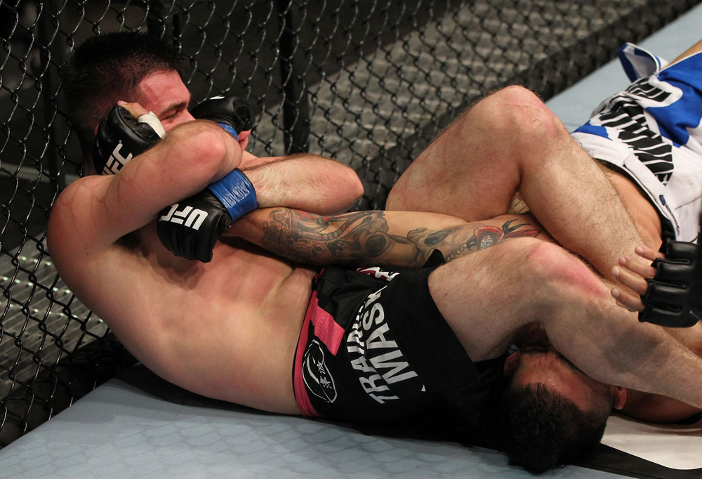 STOCKHOLM, SWEDEN - APRIL 14: (L-R) John Maguire secures an arm bar submission against Damarques Johnson during their welterweight bout at the UFC on Fuel TV event at Ericsson Globe on April 14, 2012 in Stockholm, Sweden. (Photo by Josh Hedges/Zuffa LLC/Zuffa LLC via Getty Images)