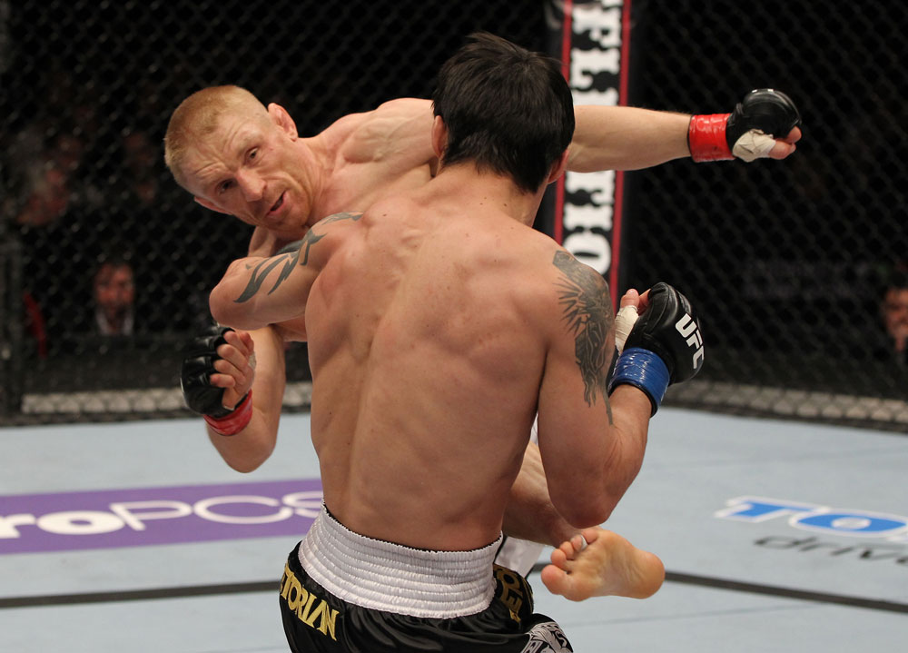 STOCKHOLM, SWEDEN - APRIL 14: (L-R) Dennis Siver kicks Diego Nunes during their featherweight bout at the UFC on Fuel TV event at Ericsson Globe on April 14, 2012 in Stockholm, Sweden. (Photo by Josh Hedges/Zuffa LLC/Zuffa LLC via Getty Images)