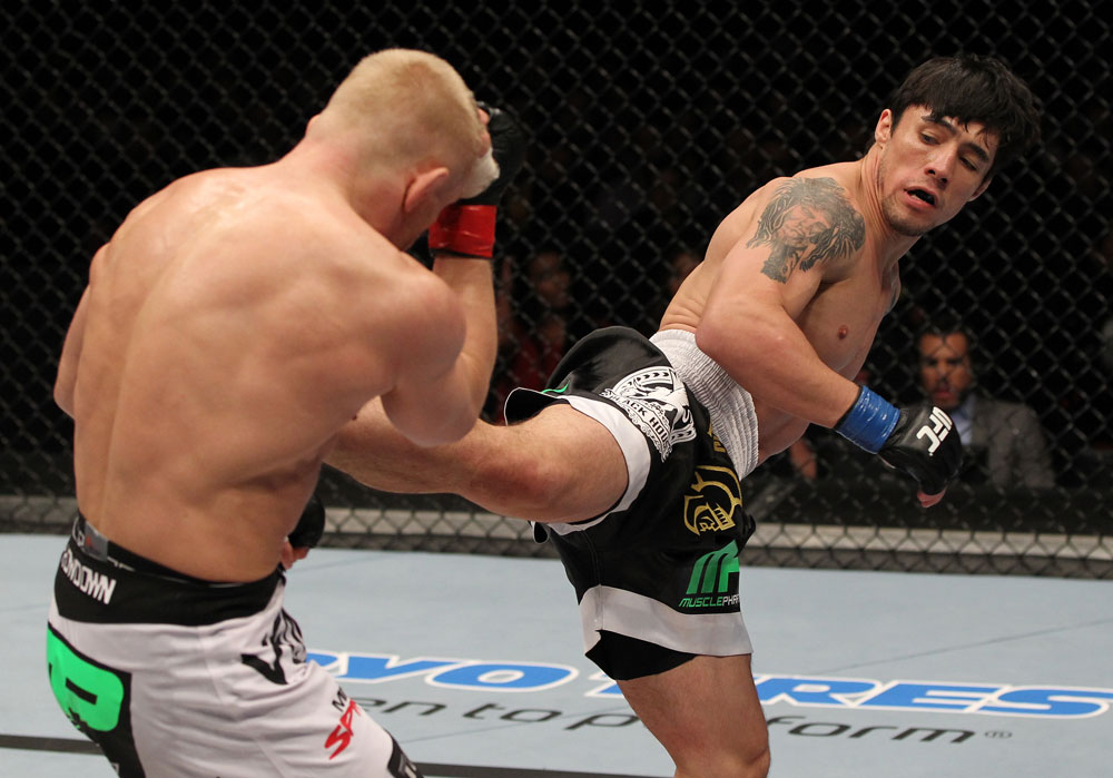 STOCKHOLM, SWEDEN - APRIL 14: (R-L) Diego Nunes kicks Dennis Siver during their featherweight bout at the UFC on Fuel TV event at Ericsson Globe on April 14, 2012 in Stockholm, Sweden. (Photo by Josh Hedges/Zuffa LLC/Zuffa LLC via Getty Images)