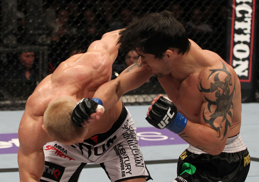 STOCKHOLM, SWEDEN - APRIL 14: (R-L) Diego Nunes punches Dennis Siver during their featherweight bout at the UFC on Fuel TV event at Ericsson Globe on April 14, 2012 in Stockholm, Sweden. (Photo by Josh Hedges/Zuffa LLC/Zuffa LLC via Getty Images)