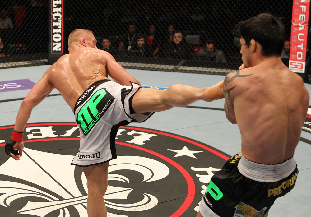 STOCKHOLM, SWEDEN - APRIL 14: (L-R) Dennis Siver kicks Diego Nunes during their featherweight bout at the UFC on Fuel TV event at Ericsson Globe on April 14, 2012 in Stockholm, Sweden. (Photo by Josh Hedges/Zuffa LLC/Zuffa LLC via Getty Images)
