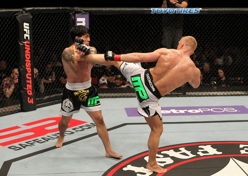 STOCKHOLM, SWEDEN - APRIL 14: (R-L) Dennis Siver kicks Diego Nunes during their featherweight bout at the UFC on Fuel TV event at Ericsson Globe on April 14, 2012 in Stockholm, Sweden. (Photo by Josh Hedges/Zuffa LLC/Zuffa LLC via Getty Images)