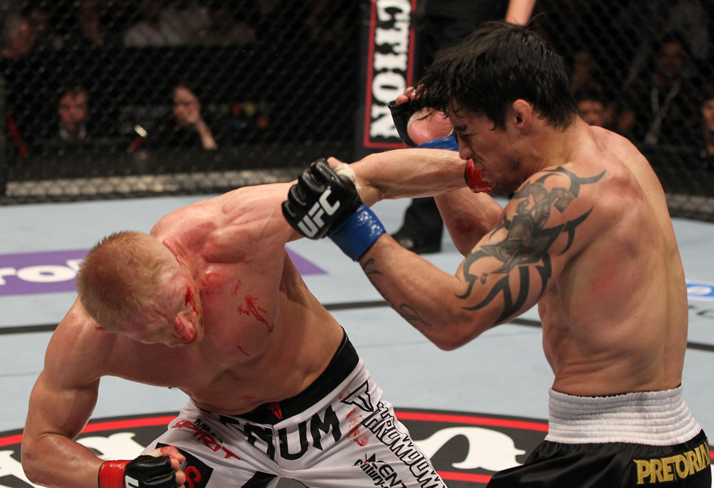 STOCKHOLM, SWEDEN - APRIL 14: (L-R) Dennis Siver punches Diego Nunes during their featherweight bout at the UFC on Fuel TV event at Ericsson Globe on April 14, 2012 in Stockholm, Sweden. (Photo by Josh Hedges/Zuffa LLC/Zuffa LLC via Getty Images)