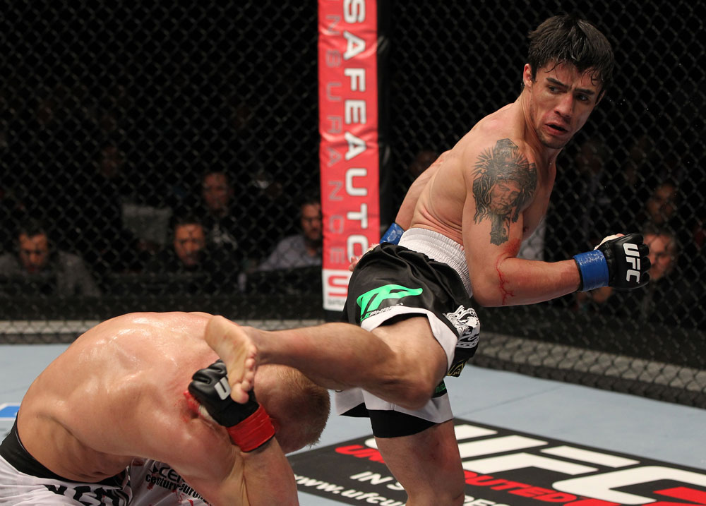 STOCKHOLM, SWEDEN - APRIL 14: (R-L) Diego Nunes kicks Dennis Siver during their featherweight bout at the UFC on Fuel TV event at Ericsson Globe on April 14, 2012 in Stockholm, Sweden. (Photo by Josh Hedges/Zuffa LLC/Zuffa LLC via Getty Images)