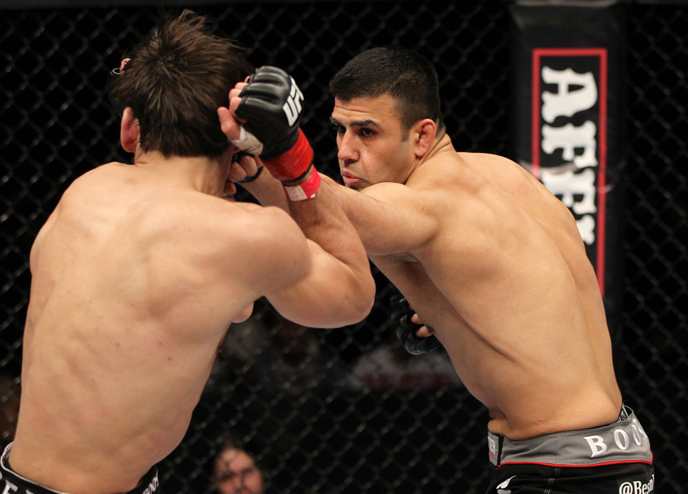 STOCKHOLM, SWEDEN - APRIL 14: (R-L) Besam Yousef punches Simeon Thoresen during their welterweight bout at the UFC on Fuel TV event at Ericsson Globe on April 14, 2012 in Stockholm, Sweden. (Photo by Josh Hedges/Zuffa LLC/Zuffa LLC via Getty Images)